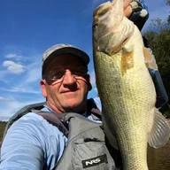 Tim Isaacs holding a bass